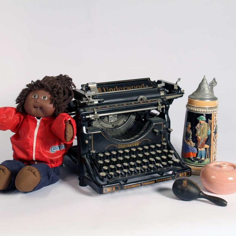 Cabbage Patch Doll, 1980s; Typewriter, early 20th century (Howard County Historical Society, Ellicott City, Maryland); Darning egg, c. 1920; Beer stein, 1940s (Hank and Karen Griffith); Russel Wright Sugar bowl, 1940s. Photo by Museum staff. 