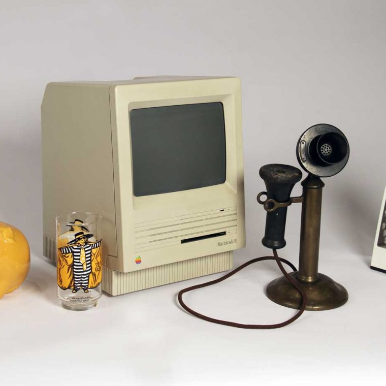 Toothbrush holder, 1970s; Hamburglar Juice Glass, 1980s; Macintosh computer monitor, 1987-1990; Candlestick telephone, 1920s; Cheese grater , 2007. Photo by Museum staff. 