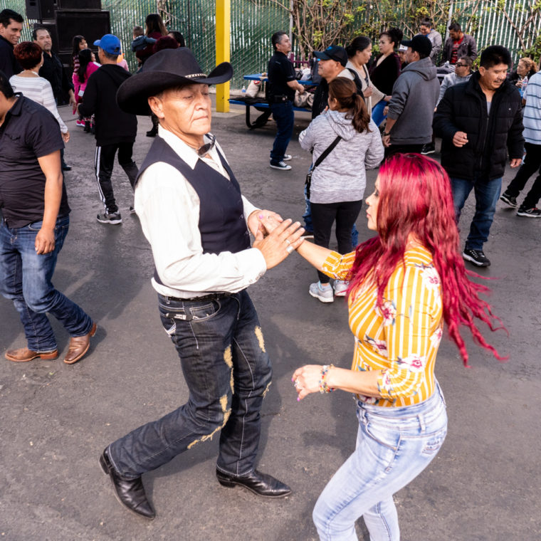 March 8, 2020: Dancing at the West Wind Coliseum Public Market, 5401 Coliseum Way, Oakland, California. © Camilo José Vergara 