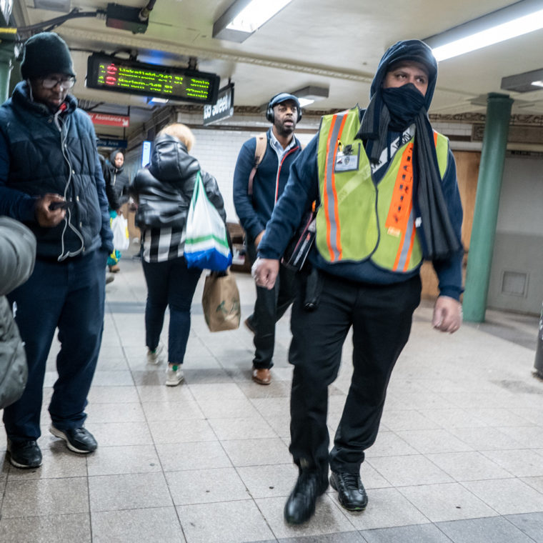 March 18, 2020: Security guard at 135th Street subway station at Lenox Avenue, Harlem, New York, New York. © Camilo José Vergara 