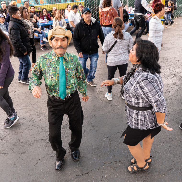 March 8, 2020: Ermelinda dancing at the West Wind Coliseum Public Market, 5401 Coliseum Way, Oakland, California. © Camilo José Vergara 