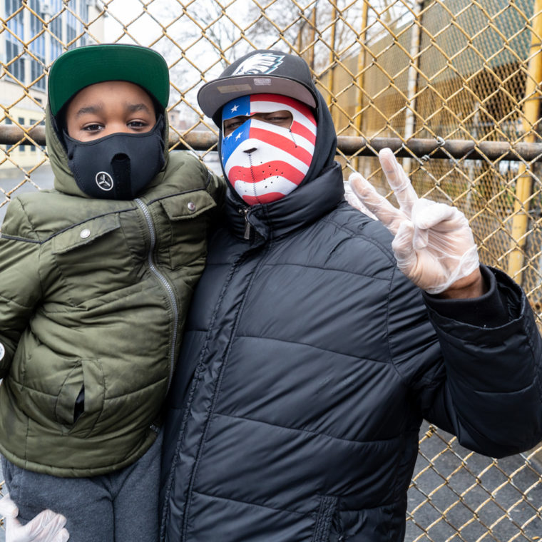 March 29, 2020: Jamal and his son Jamal Jr. on Willis Avenue at East 140th Street, Bronx, New York. © Camilo José Vergara 