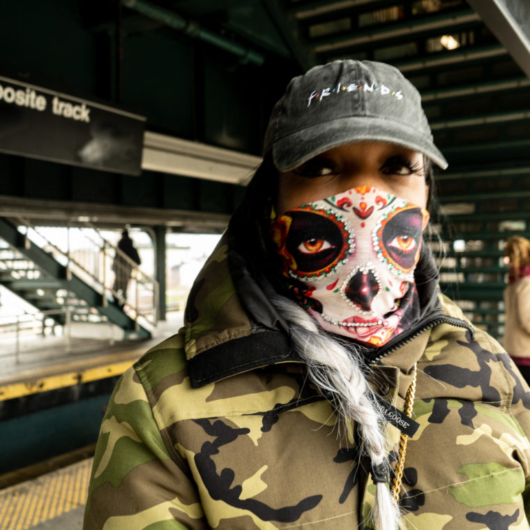 March 30, 2020: Tasha wearing her custom-crafted mask at the Broadway Junction subway station, Brooklyn, New York. © Camilo José Vergara 