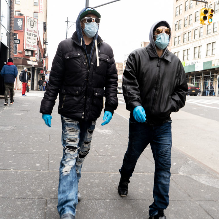 March 31, 2020: Friends wearing their version of protective gear on East 149th Street west of Third Avenue, Bronx, New York. © Camilo José Vergara 