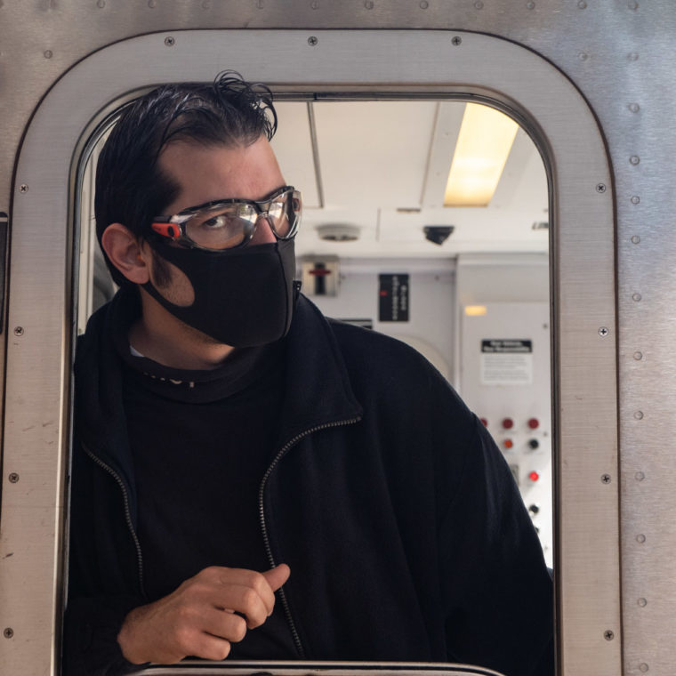 May 3, 2020: Subway conductor at the Simpson Street Subway Station, Bronx, New York. © Camilo José Vergara 