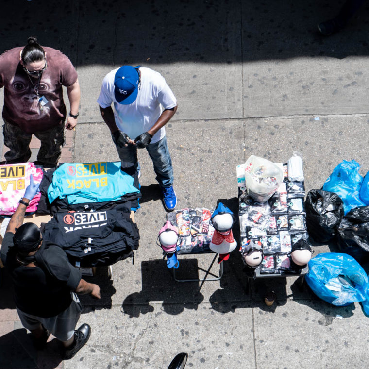 June 17, 2020: Black Lives Matter T-shirts and PPE for sale under the Simpson Street Subway Station. Westchester Avenue south of Southern Boulevard, Bronx, New York. © Camilo José Vergara 