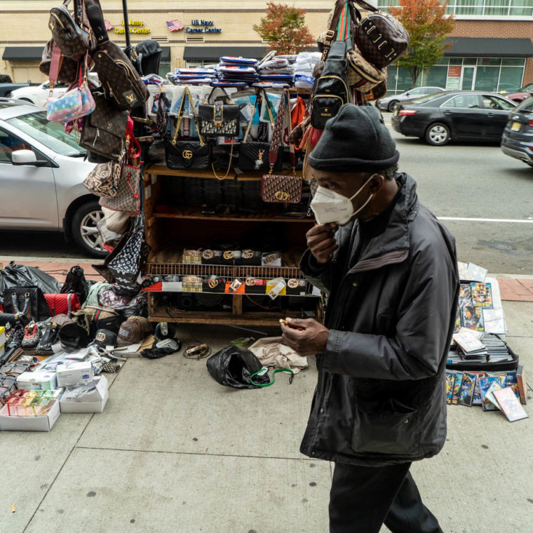 October 23, 2020: Selling knockoff Gucci and Fendi. 855 Broad Street, Newark, New Jersey. © Camilo José Vergara 