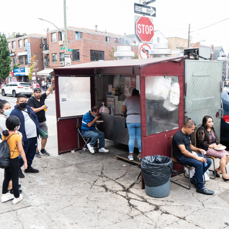 September 27, 2020: Food truck with sitting area. Roosevelt Avenue at 99th Street, Queens, New York. © Camilo José Vergara 