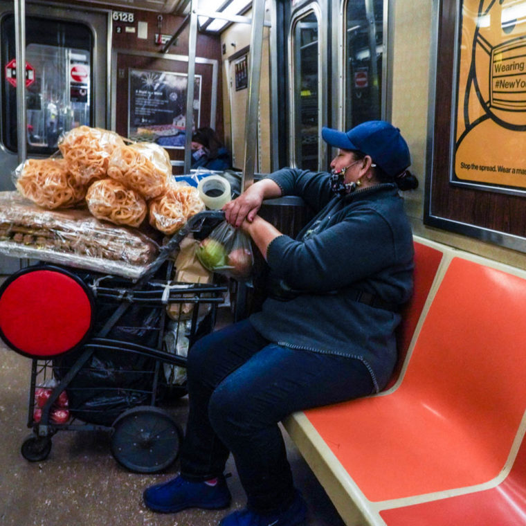 November 4, 2020: Food vendor on the A train. New York, New York. © Camilo José Vergara 