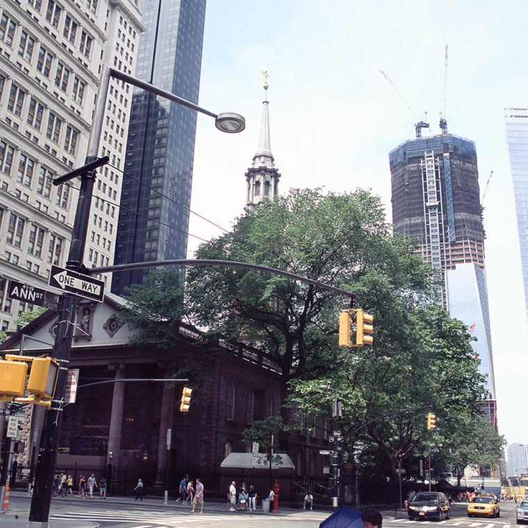 View west from St. Paul's Chapel with One World Trade Center under construction, Broadway and Fulton Street, New York, New York; 2011. 